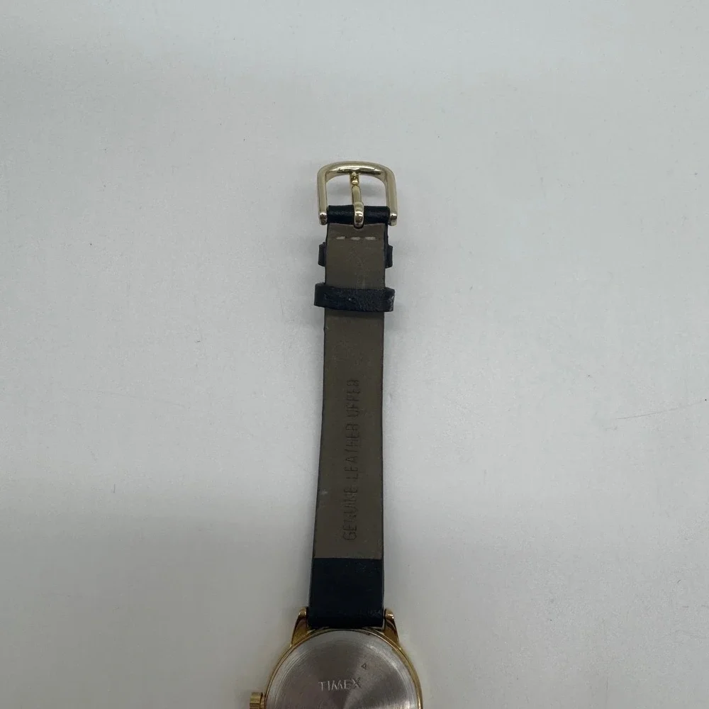 Timex Indiglo WR 30M Gold Tone White Dial Black Leather Watch CR 1216 needs bat